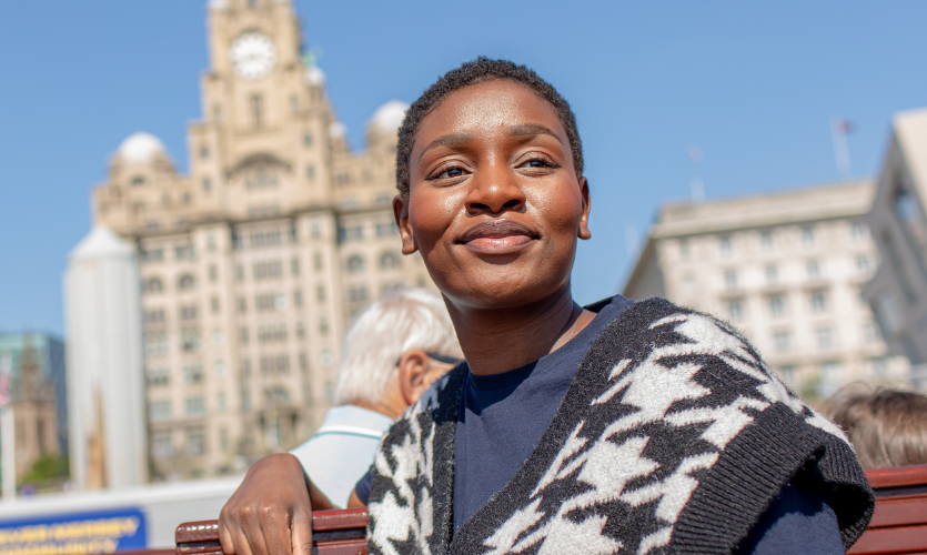 Head and shoulders image of a student named Tino sat outside of the Liver Building